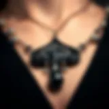 Close-up view of a black spade necklace showcasing intricate design details