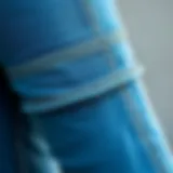 Close-up of cuffed denim jeggings showcasing intricate stitching and fabric texture