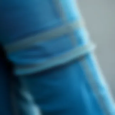 Close-up of cuffed denim jeggings showcasing intricate stitching and fabric texture