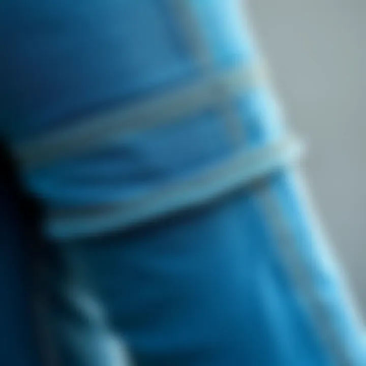 Close-up of cuffed denim jeggings showcasing intricate stitching and fabric texture