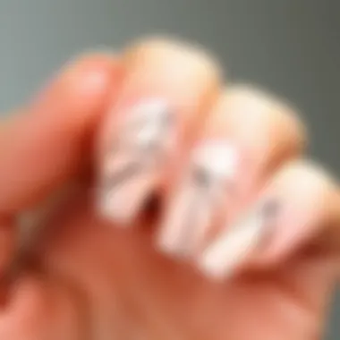 Delicate Line Designs on Minimalist Press-On Nails A close-up view of minimalist press-on nails showcasing delicate line designs.