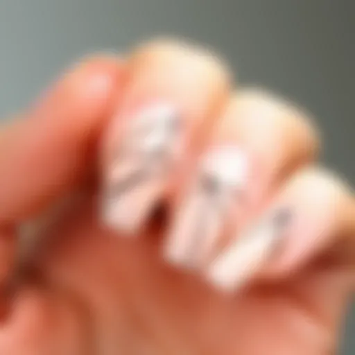 Delicate Line Designs on Minimalist Press-On Nails A close-up view of minimalist press-on nails showcasing delicate line designs.