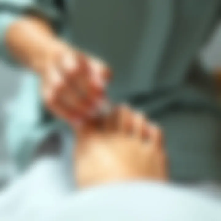 Individual applying toe separators during a pedicure