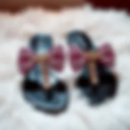 Elegant rhinestone bow sandals displayed on a plush surface