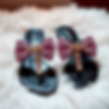 Elegant rhinestone bow sandals displayed on a plush surface