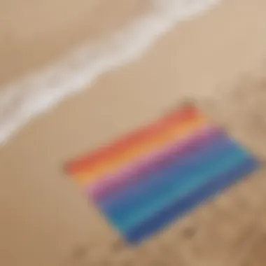 Vibrant Beach Mat on Sandy Shore A vibrant beach mat spread on the sand with ocean waves in the background